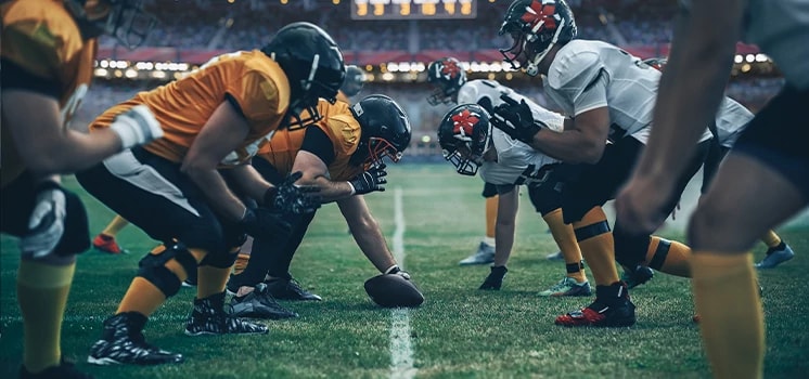 Pro football players on a football field.